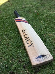 A finished de Lacy bat laying in the grass - ready to be sent to it's new owner in Gippsland