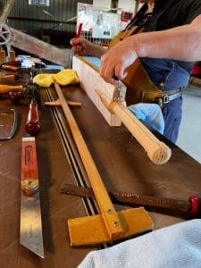 Clare Johnston of de Lacy cricket bat measuring a cricket bat for a Melbourne-based client