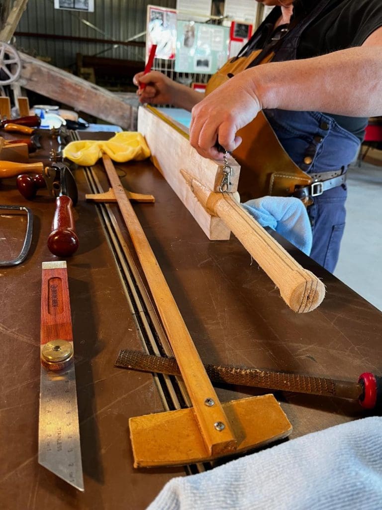 Clare Johnston of de Lacy cricket bat measuring a cricket bat for a Melbourne-based client